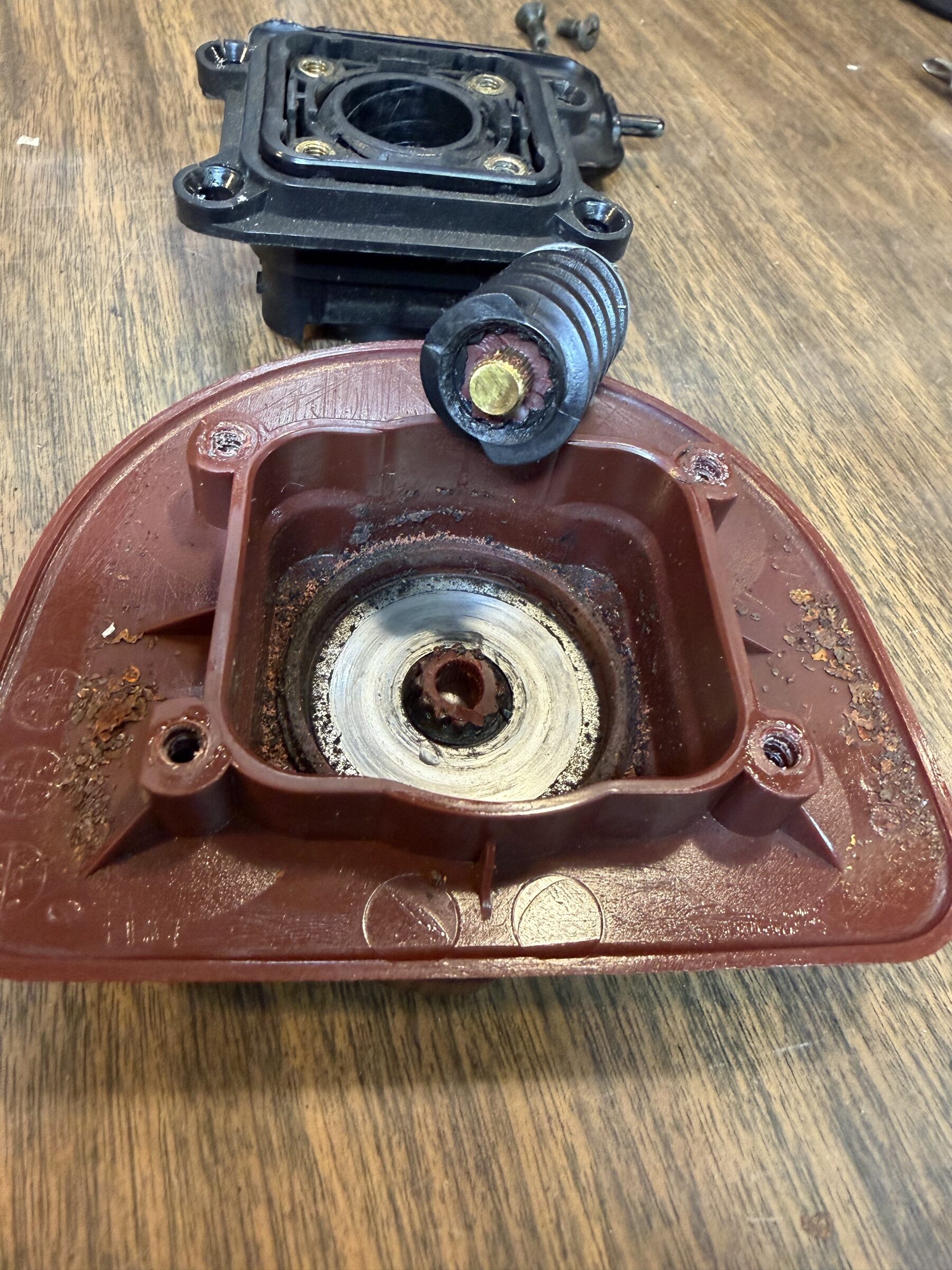 Worm gear with the stripped receiver material stuck to its core